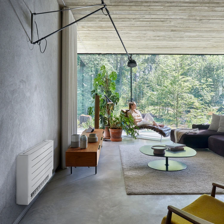 a woman sitting in a chair in a living room