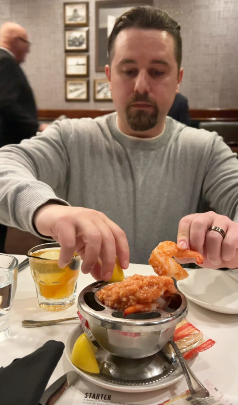 a man eating food at a restaurant