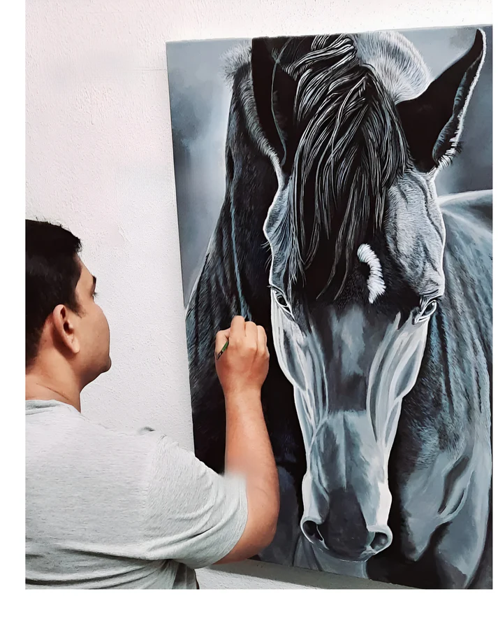 a man drawing a picture of a horse