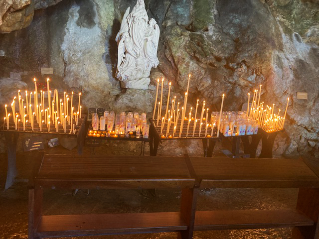 a group of candles in a cave