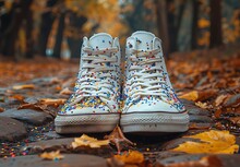 a pair of white shoes with sprinkles on top