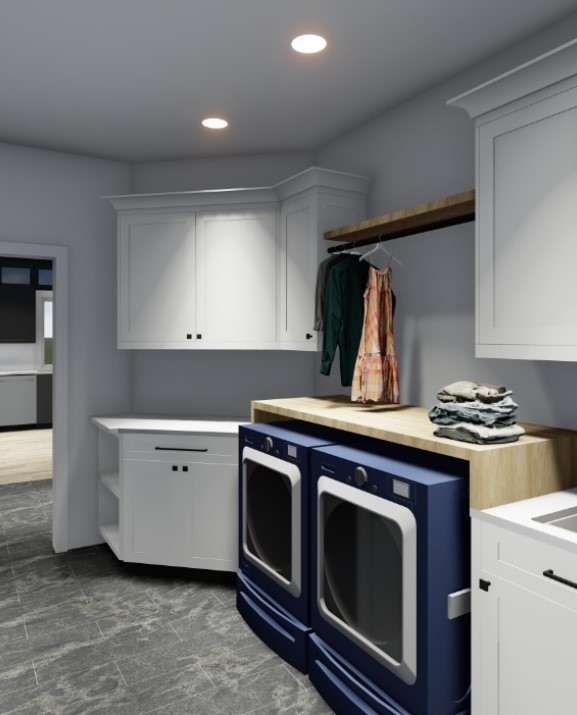 a laundry room with white cabinets and blue appliances