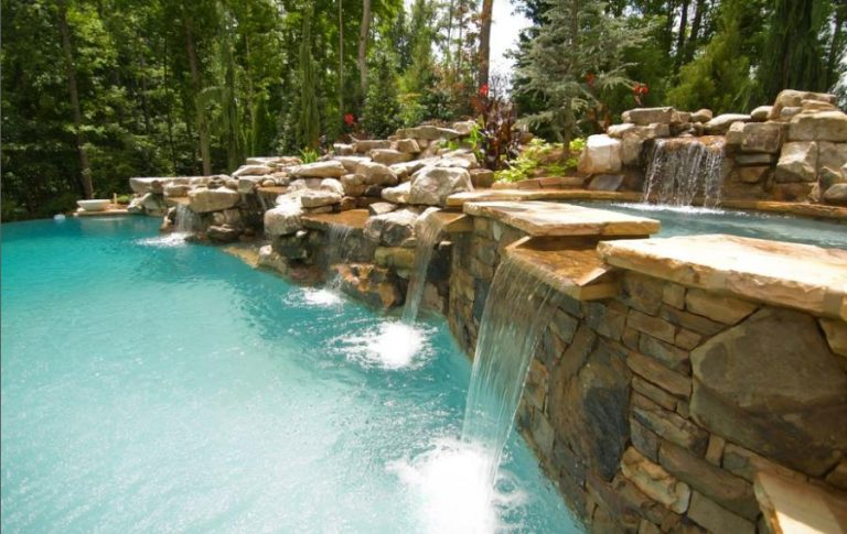 a pool with a waterfall