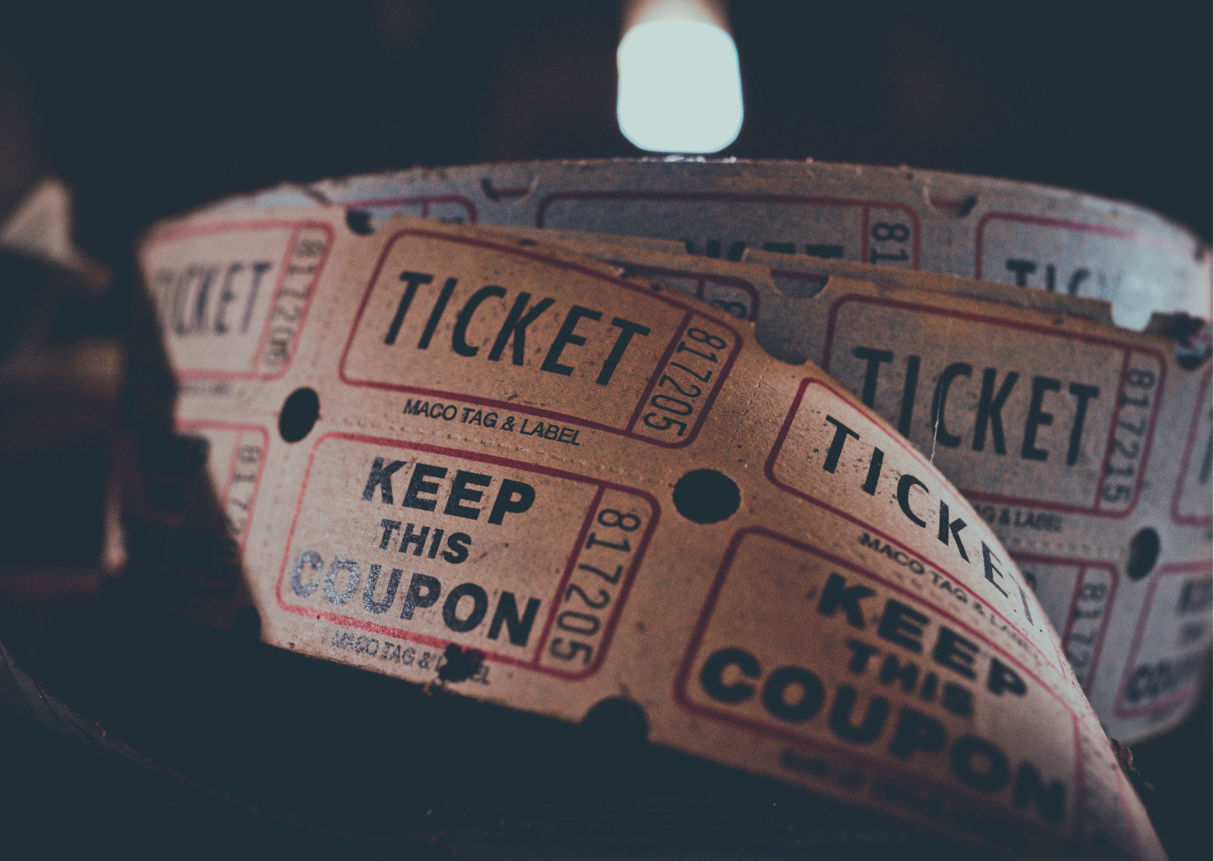 a roll of tickets with black and white text