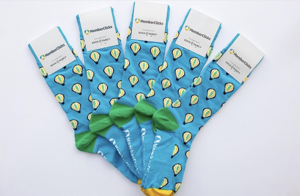 a group of blue socks with yellow and green designs