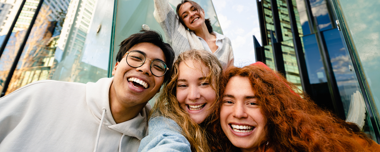 a group of people smiling for a selfie