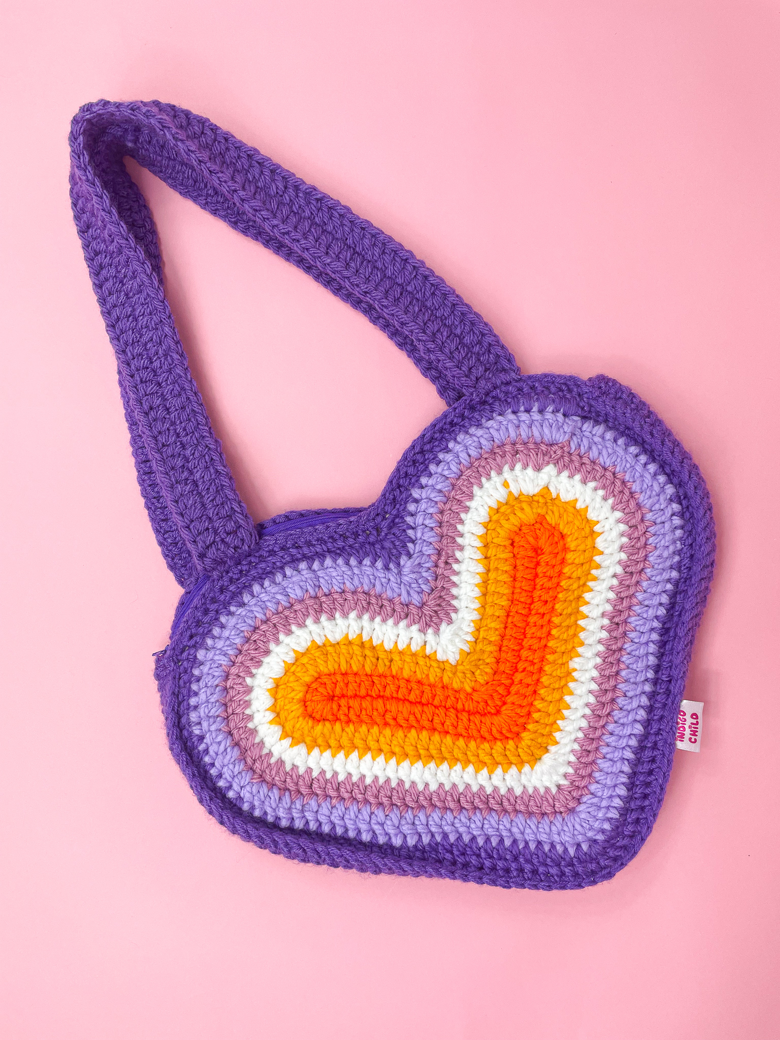 a knitted heart shaped bag
