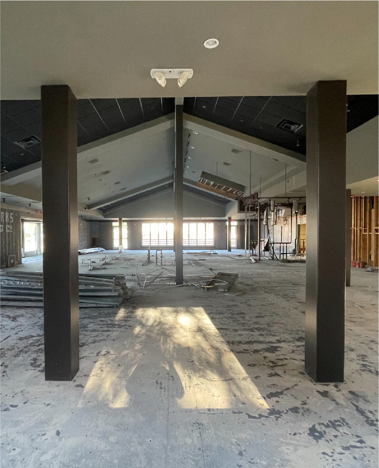 a building under construction with pillars and a ceiling