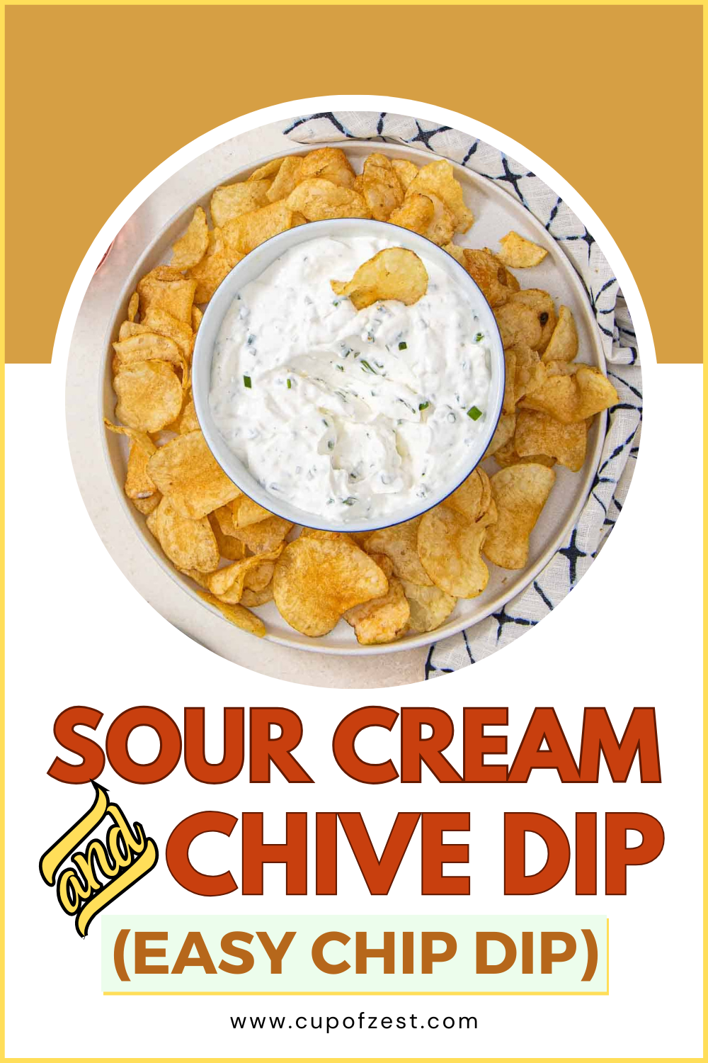 a bowl of dip on a plate of potato chips