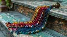 a colorful necklaces on a wooden staircase