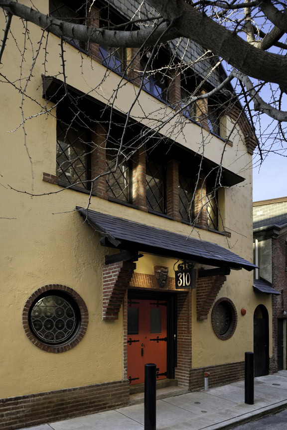 a building with a red door and windows