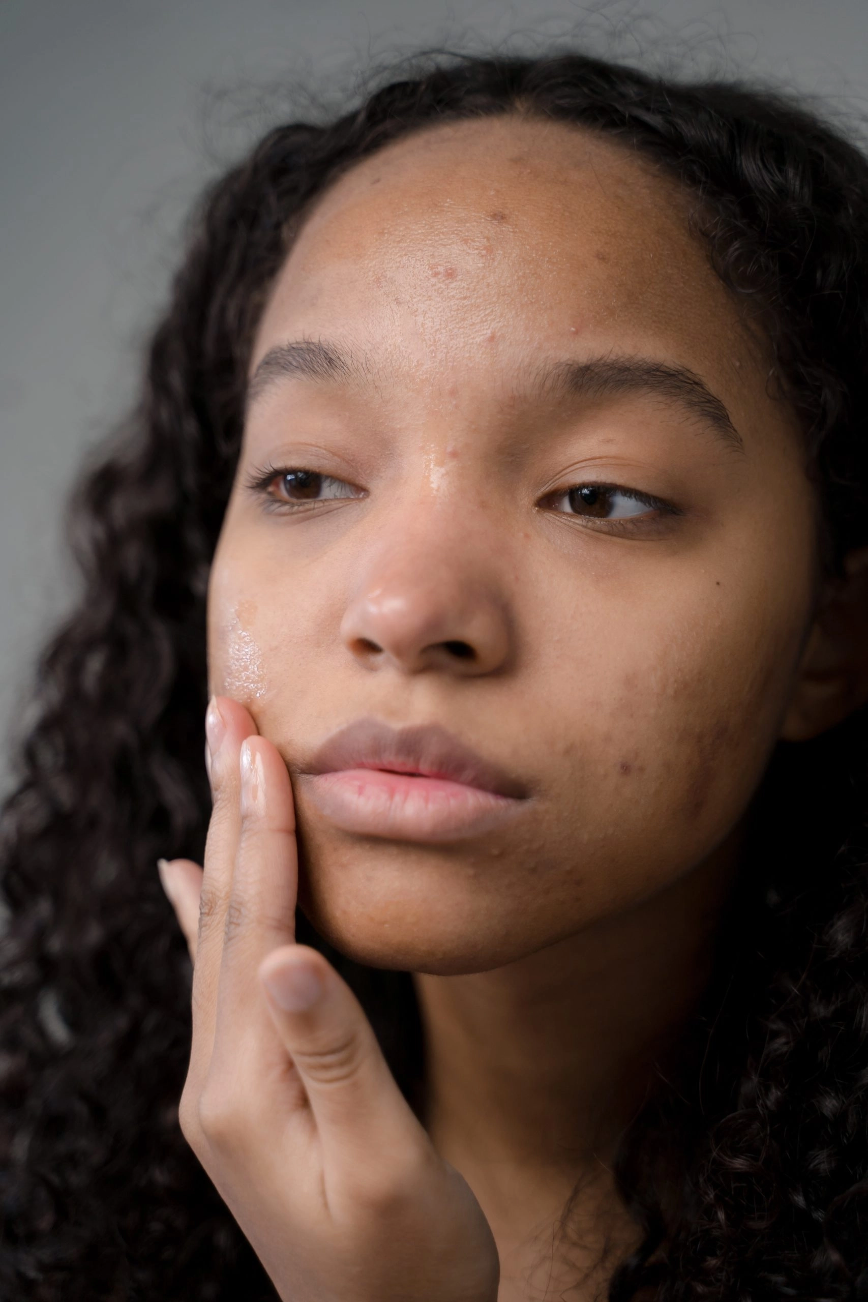 a woman with a hand on her chin