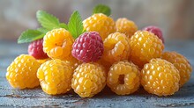 a group of yellow raspberries