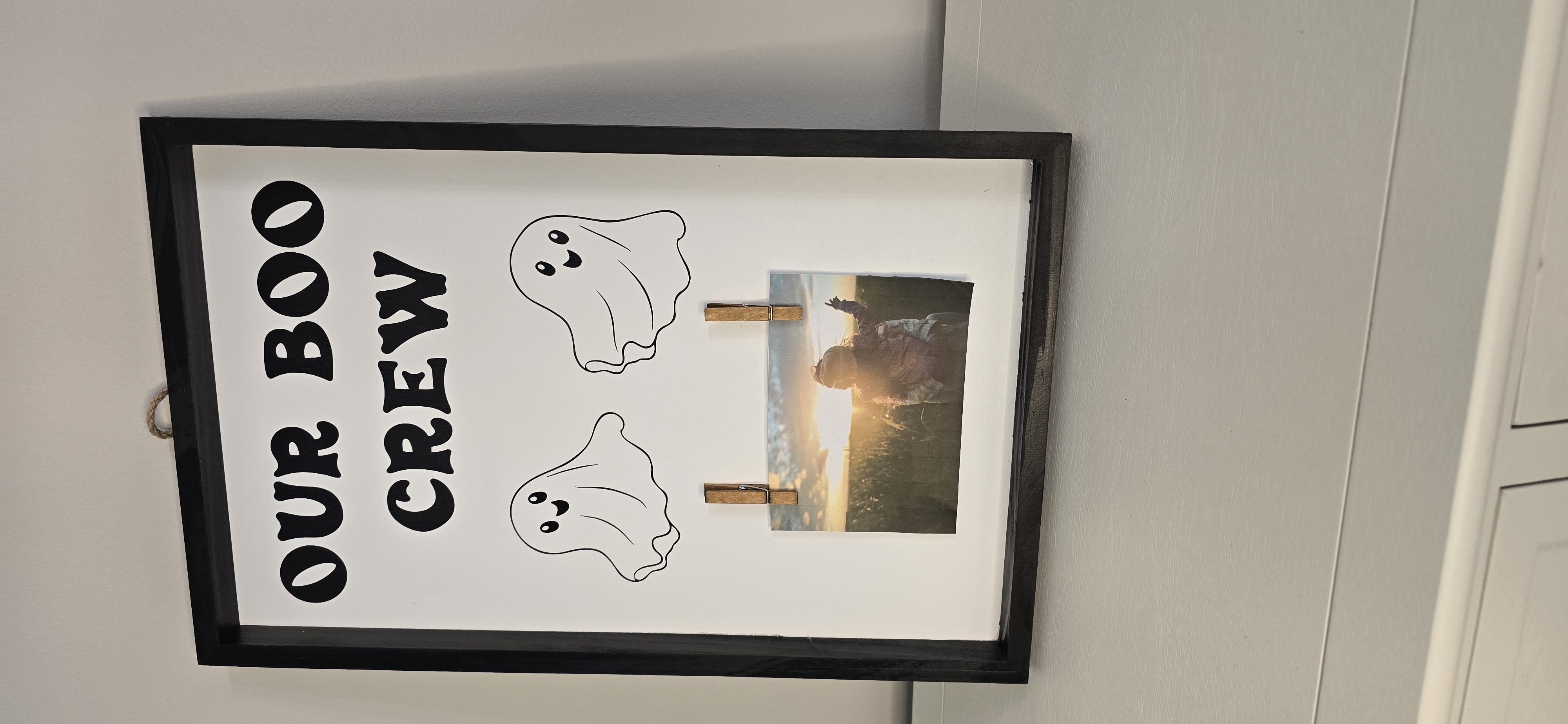 a picture frame with ghosts and a picture of a person