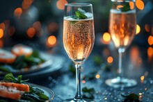 a glass of champagne with a leafy green leaf on top