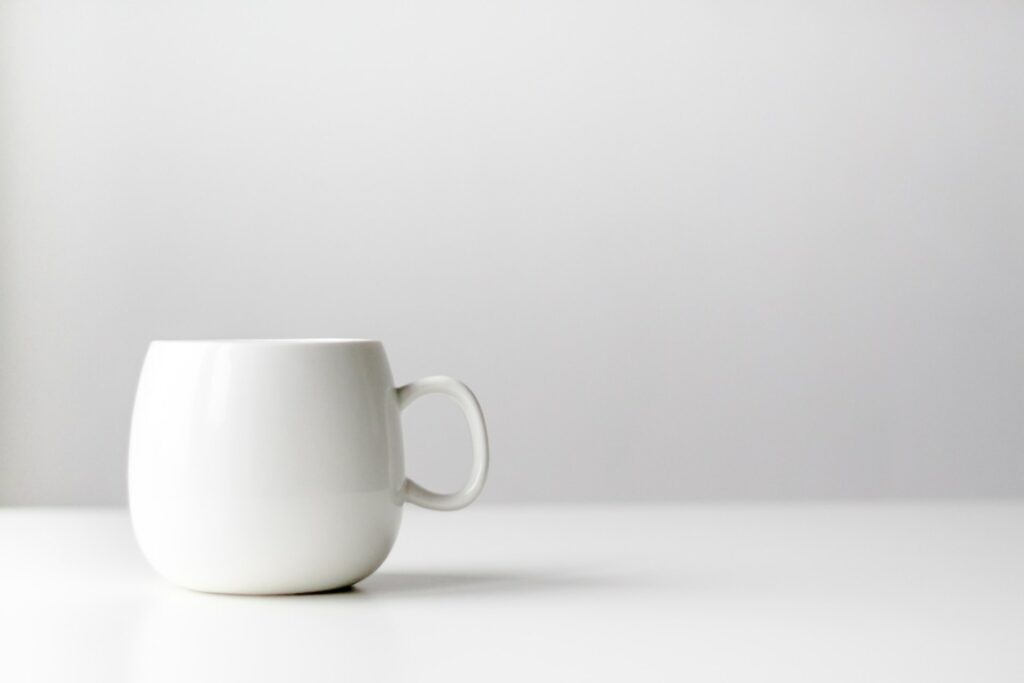 a white mug on a white surface