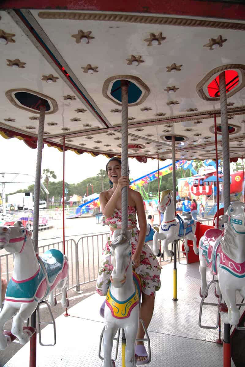 a woman on a merry go round