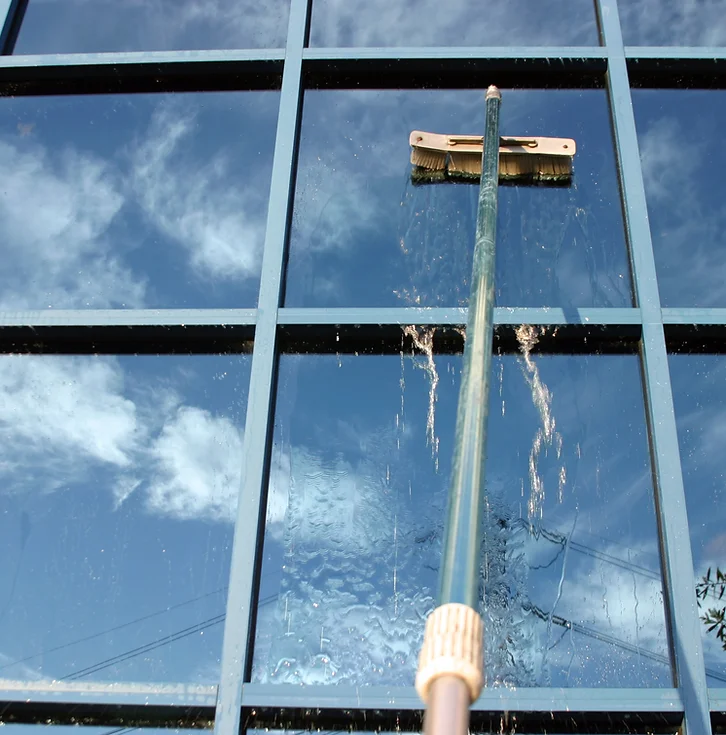 a mop cleaning a window
