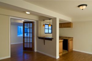 a room with a wood floor and a door