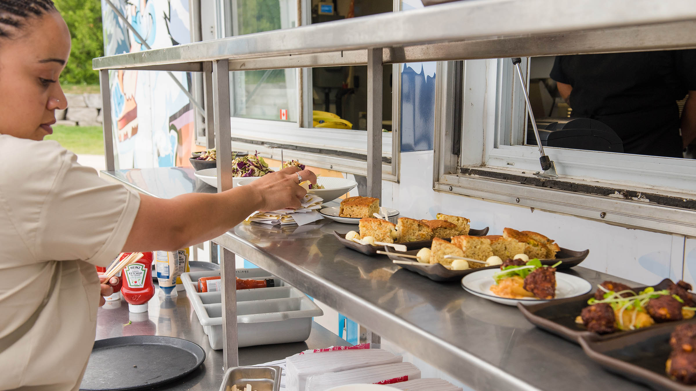 a person reaching for food on a counter