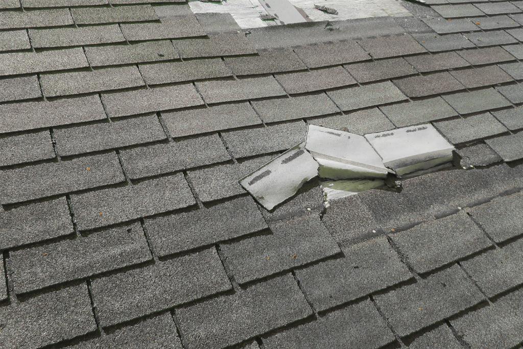 a broken roof shingles on a roof