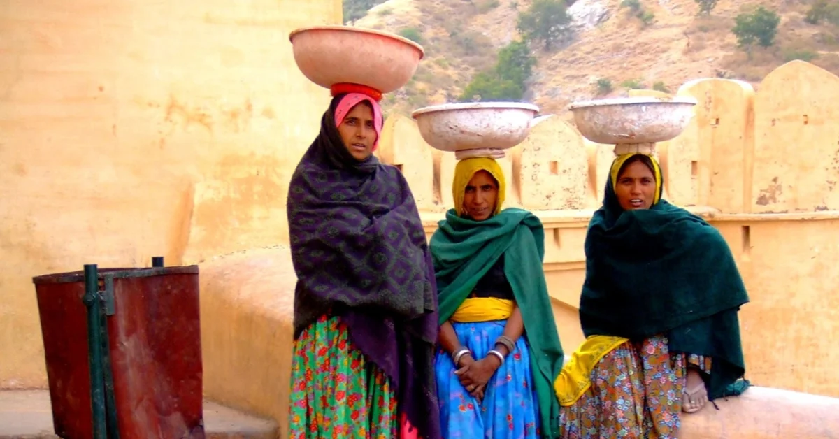 a group of women with bowls on their heads