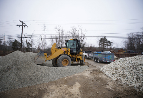 a bulldozer moving gravel