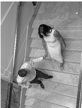 a man and woman walking up stairs