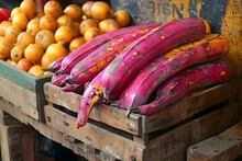 a group of bananas in a wooden crate