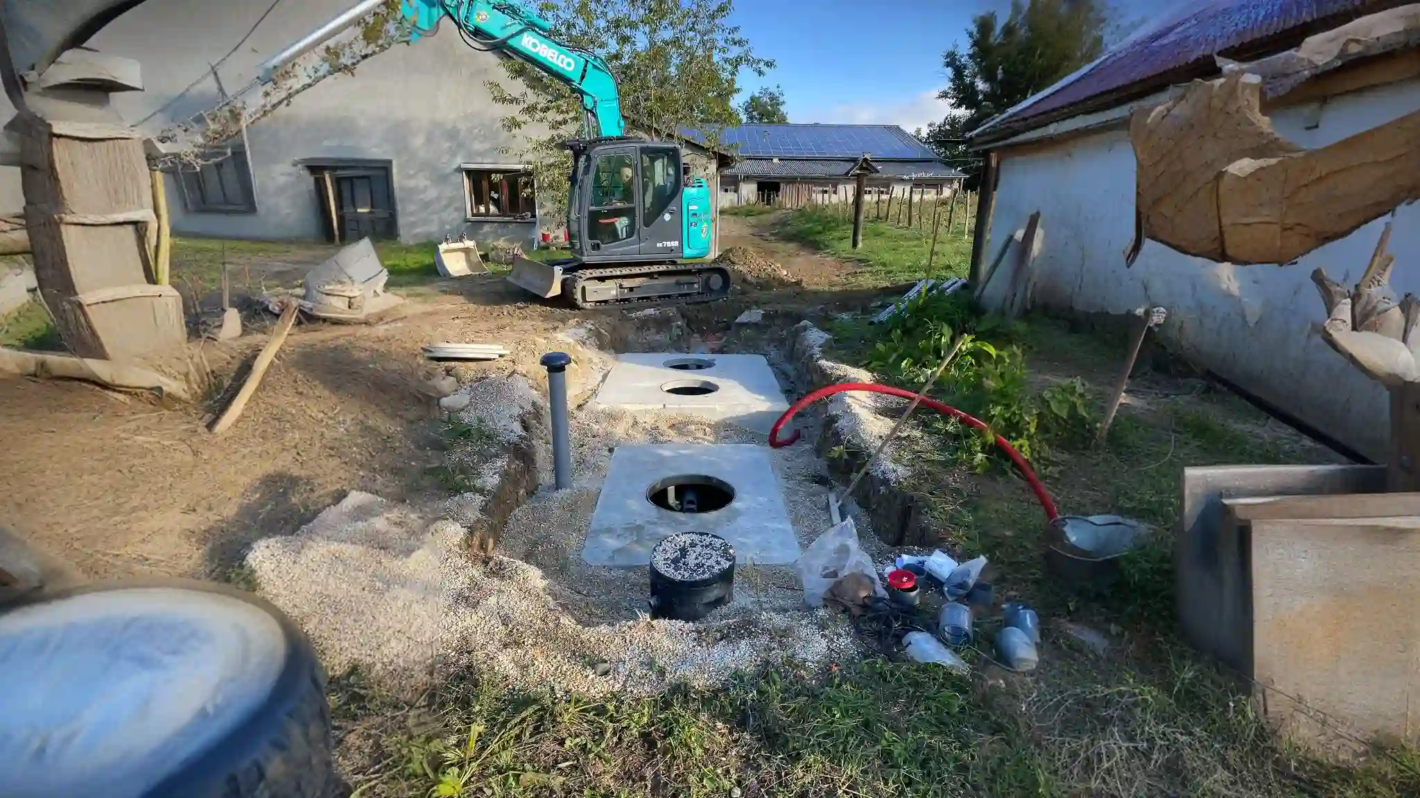 a construction site with a machine and a hole in the ground