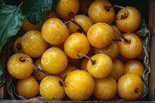 a pile of yellow cherries