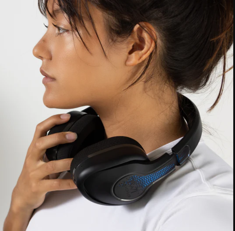 a woman with headphones around her neck