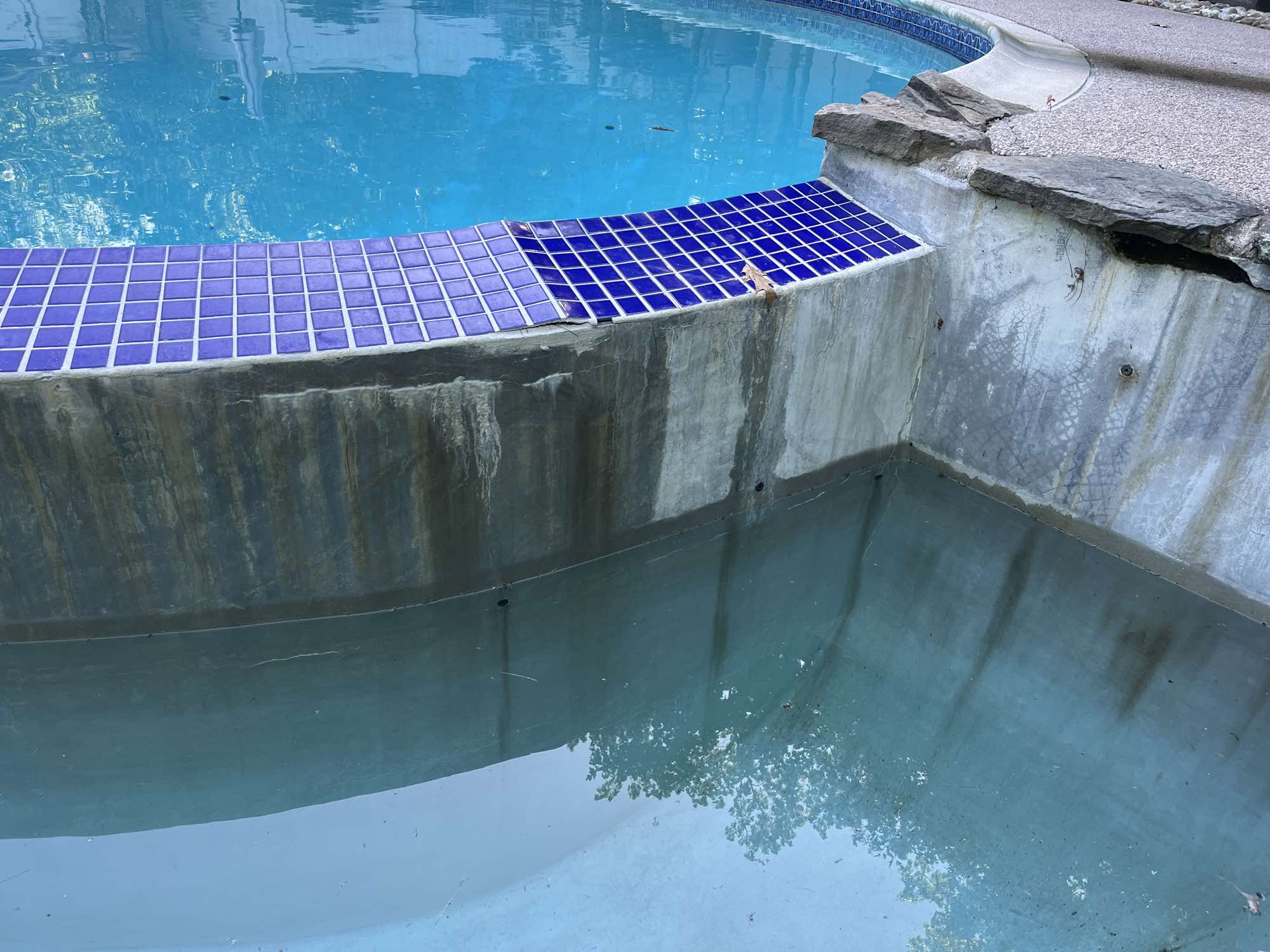 a pool with a blue tile edge