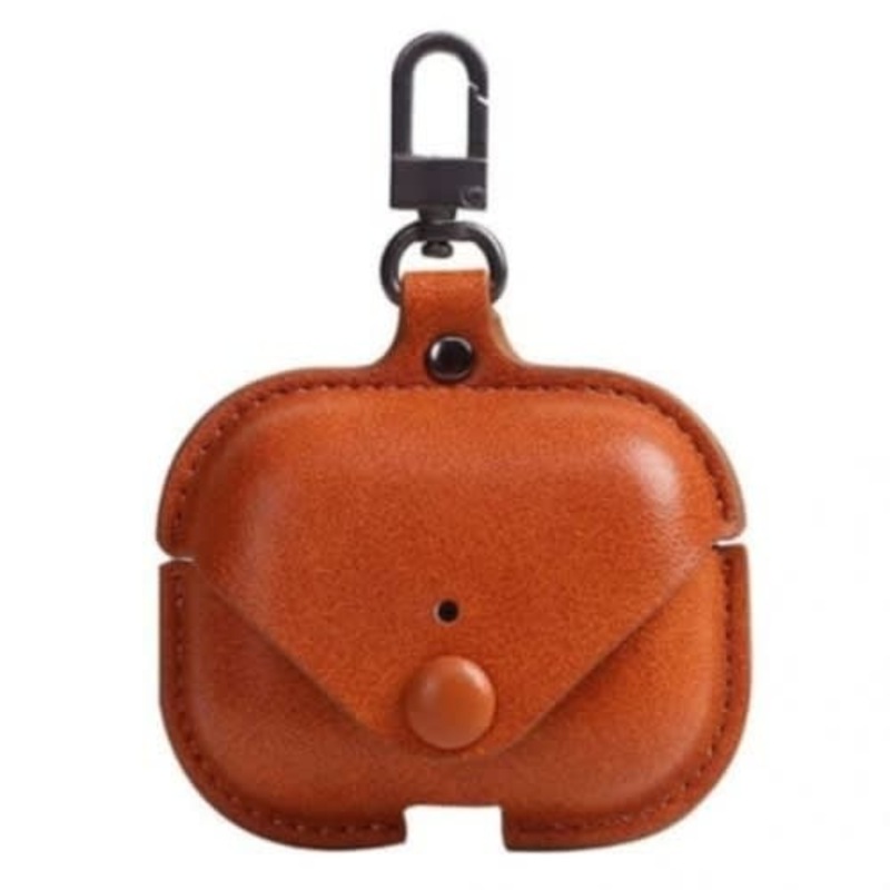 a brown leather case with a key chain