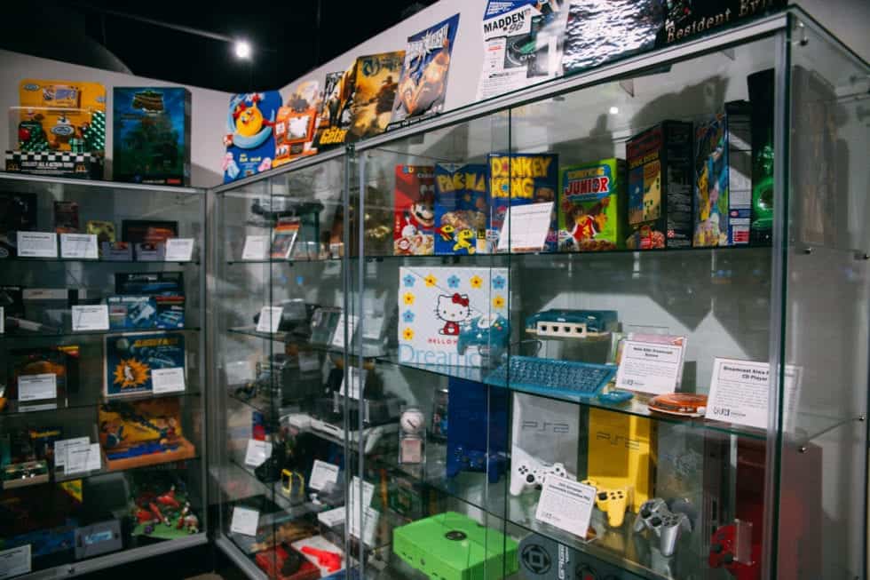 a display case with video game items
