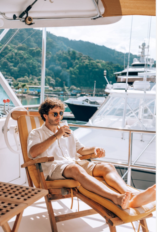 a man sitting in a chair on a boat