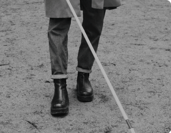 a person holding a cane