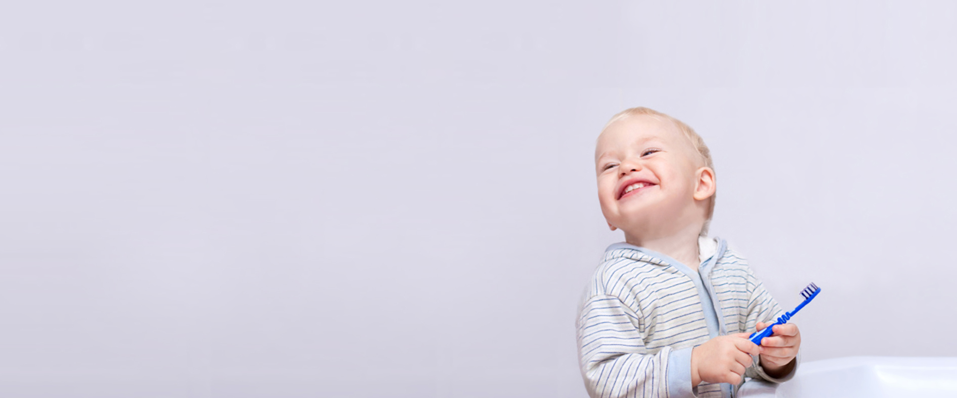 a smiling baby with a white background
