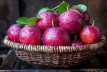 a basket of apples with water droplets on them