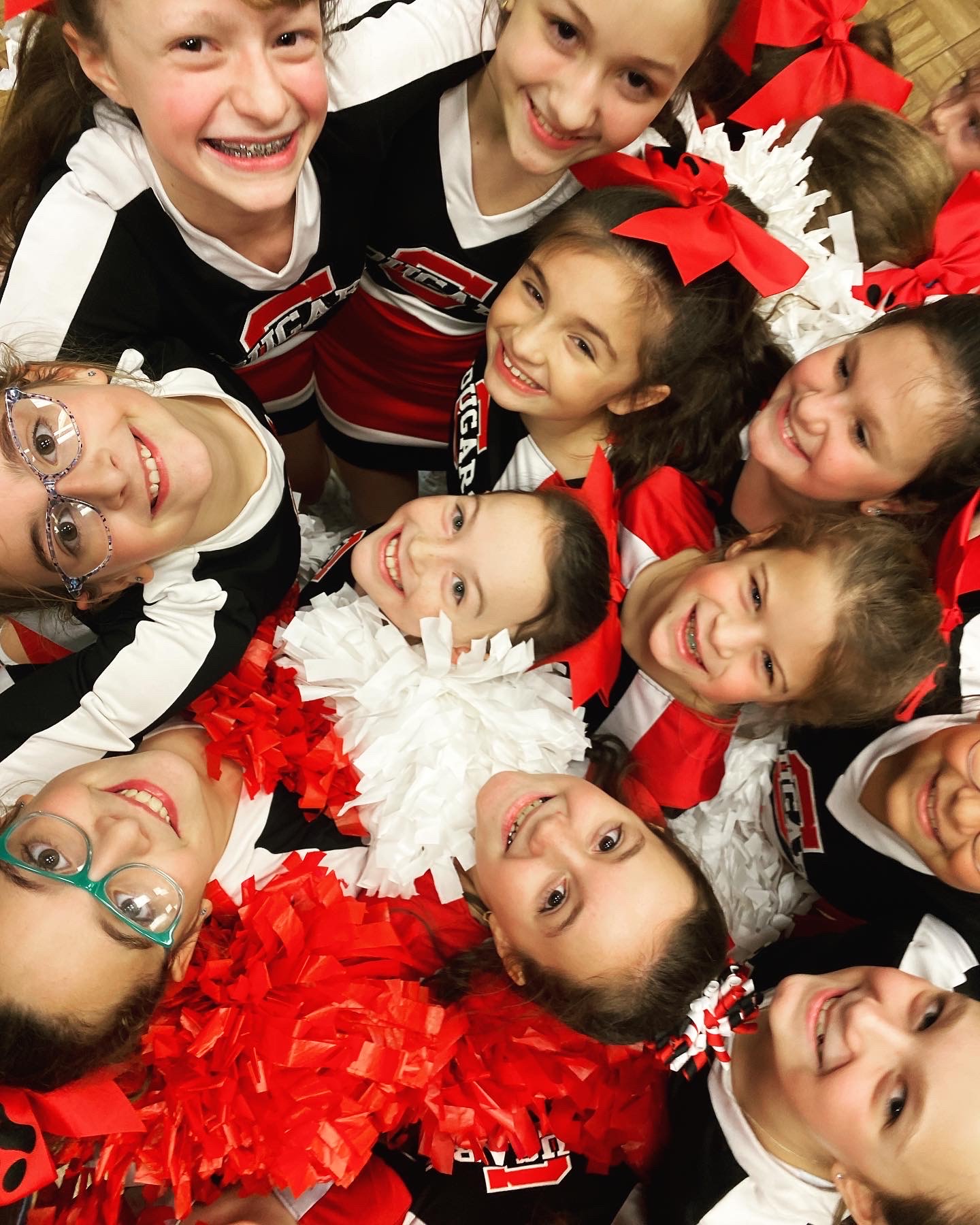 a group of girls in cheerleader outfits