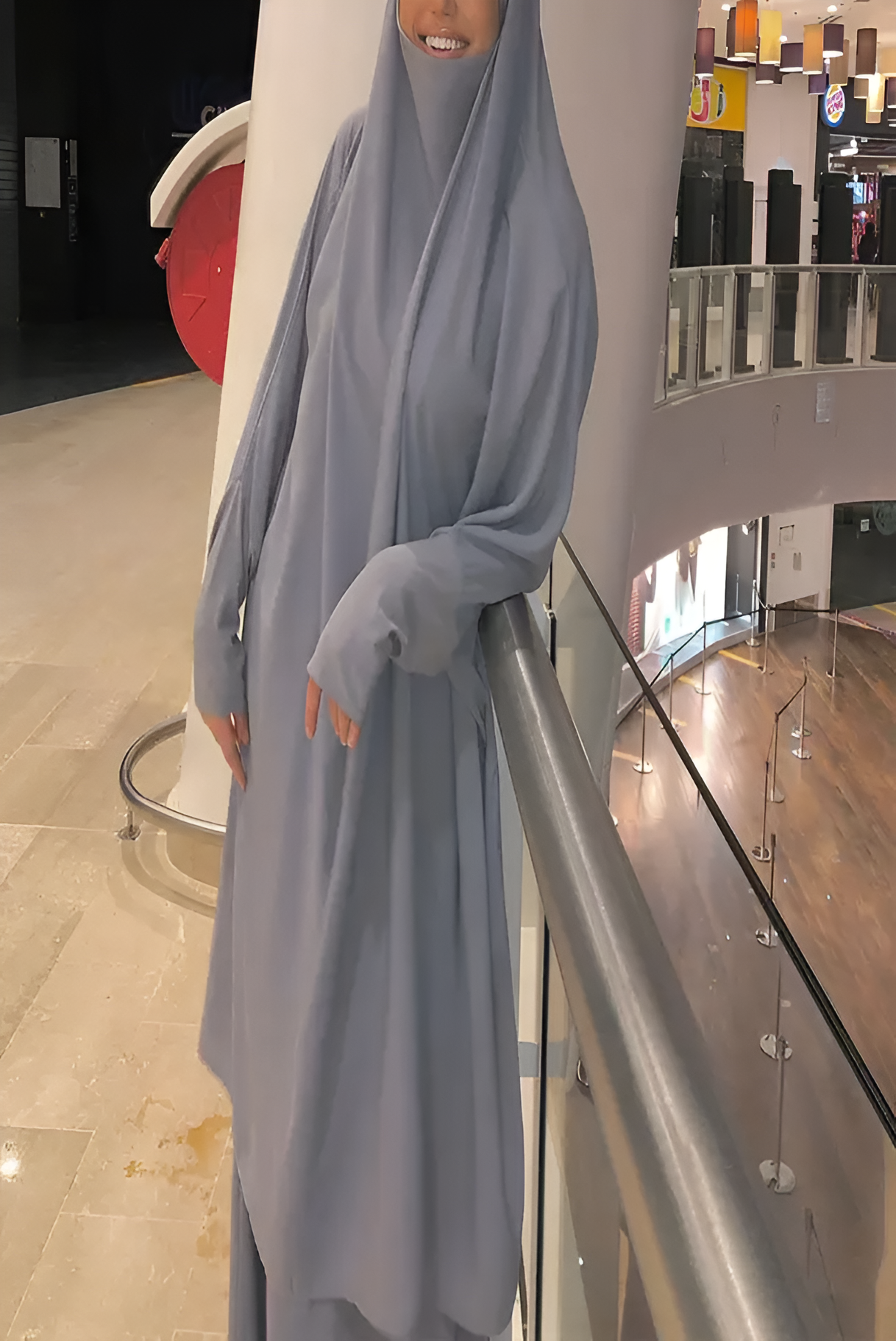 a woman wearing a grey dress