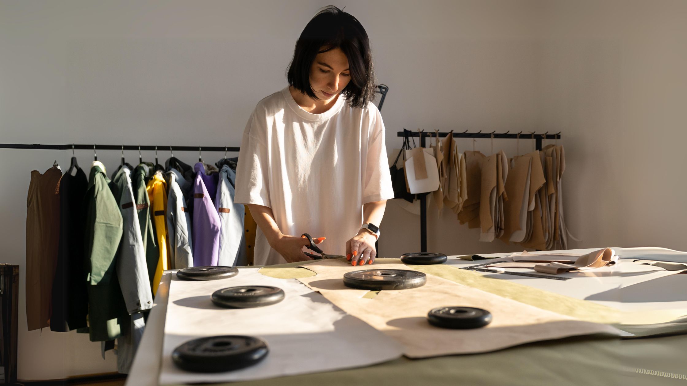 a woman cutting paper with scissors