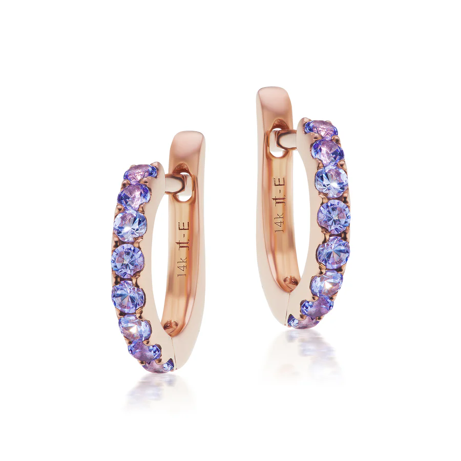a pair of earrings with purple stones