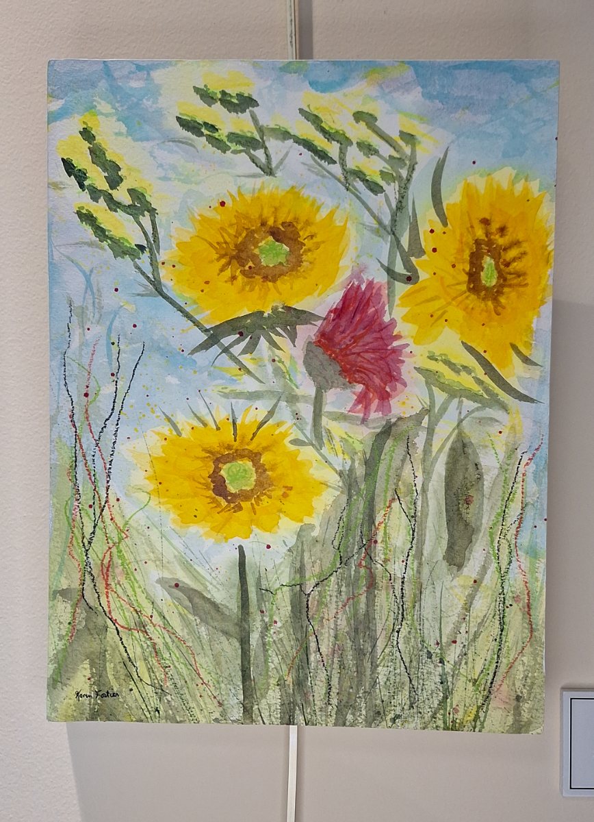 a painting of flowers on a wall