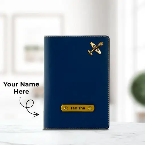 a blue passport with a gold airplane pin
