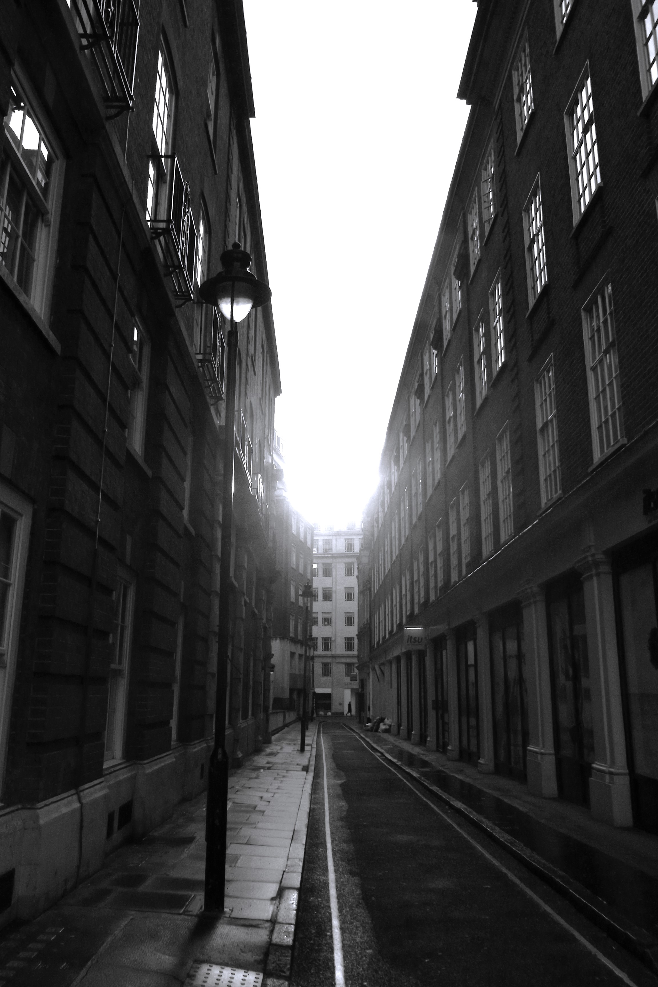 a street with buildings and a light post