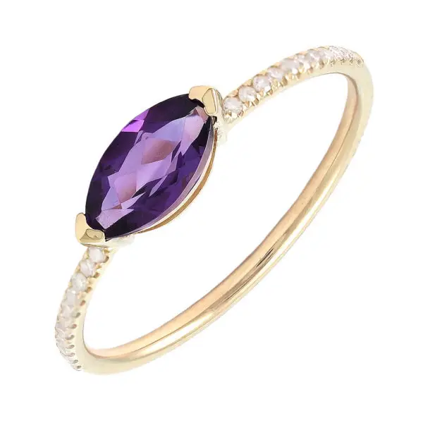a gold ring with a purple stone