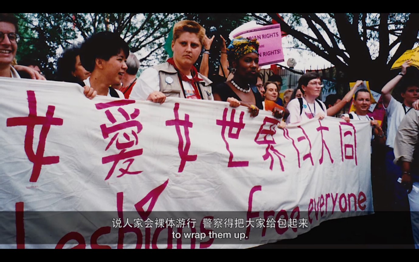 a group of people holding a banner