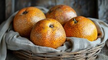 a group of oranges in a basket