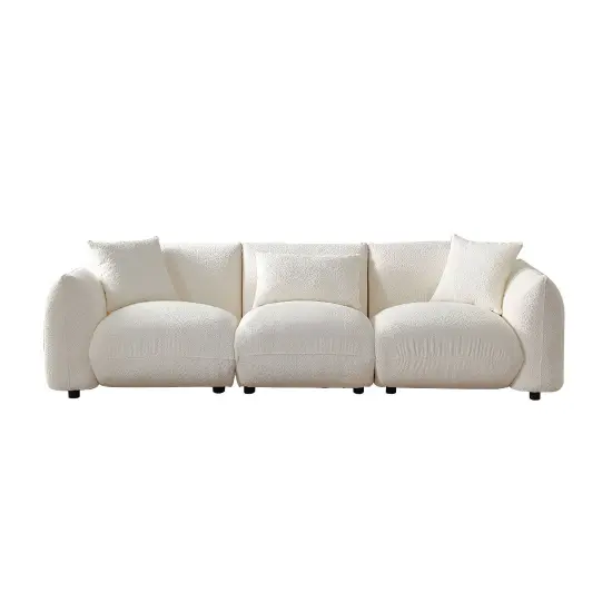 a white couch with pillows